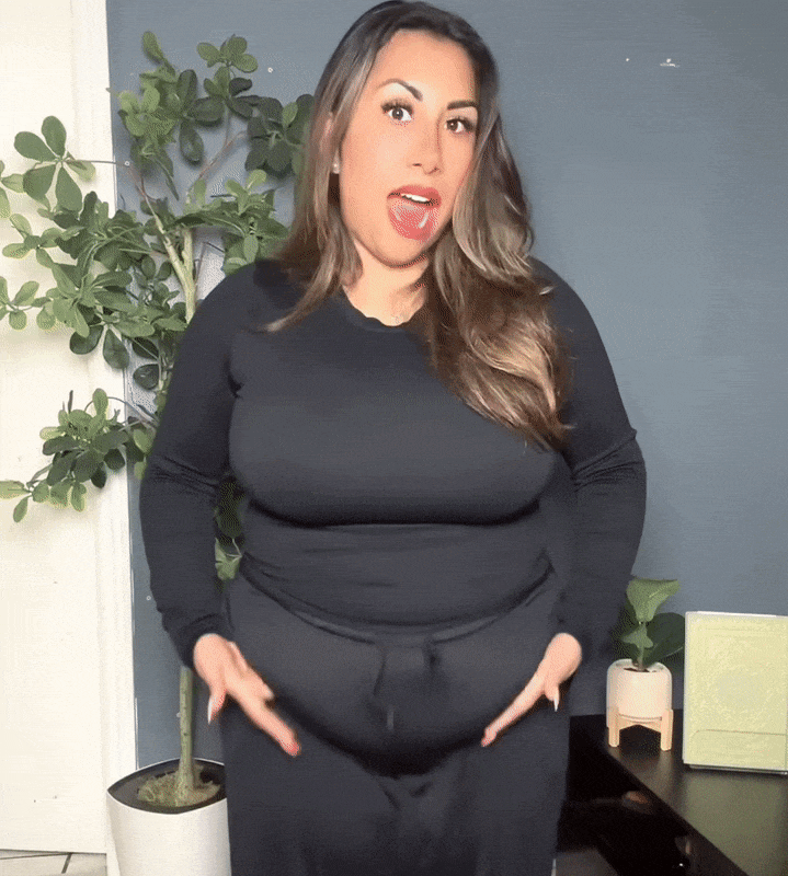 Postpartum mom — smooth, supported tummy under her clothes